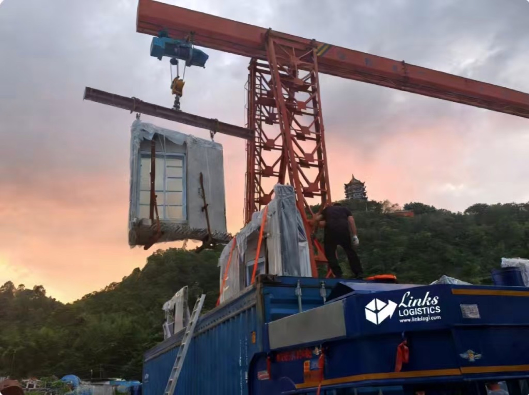 Protected cargo being loaded by a gantry crane in China