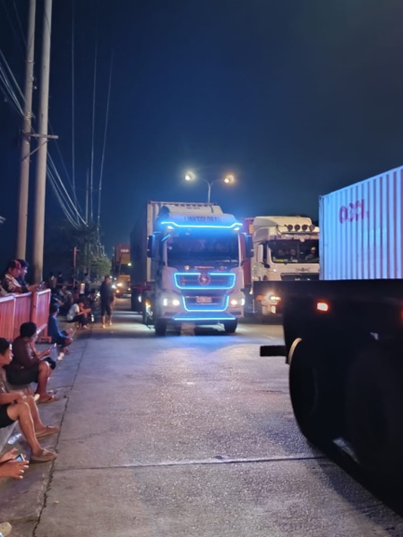 LinksGlobal truck with cyan LED lights working at night