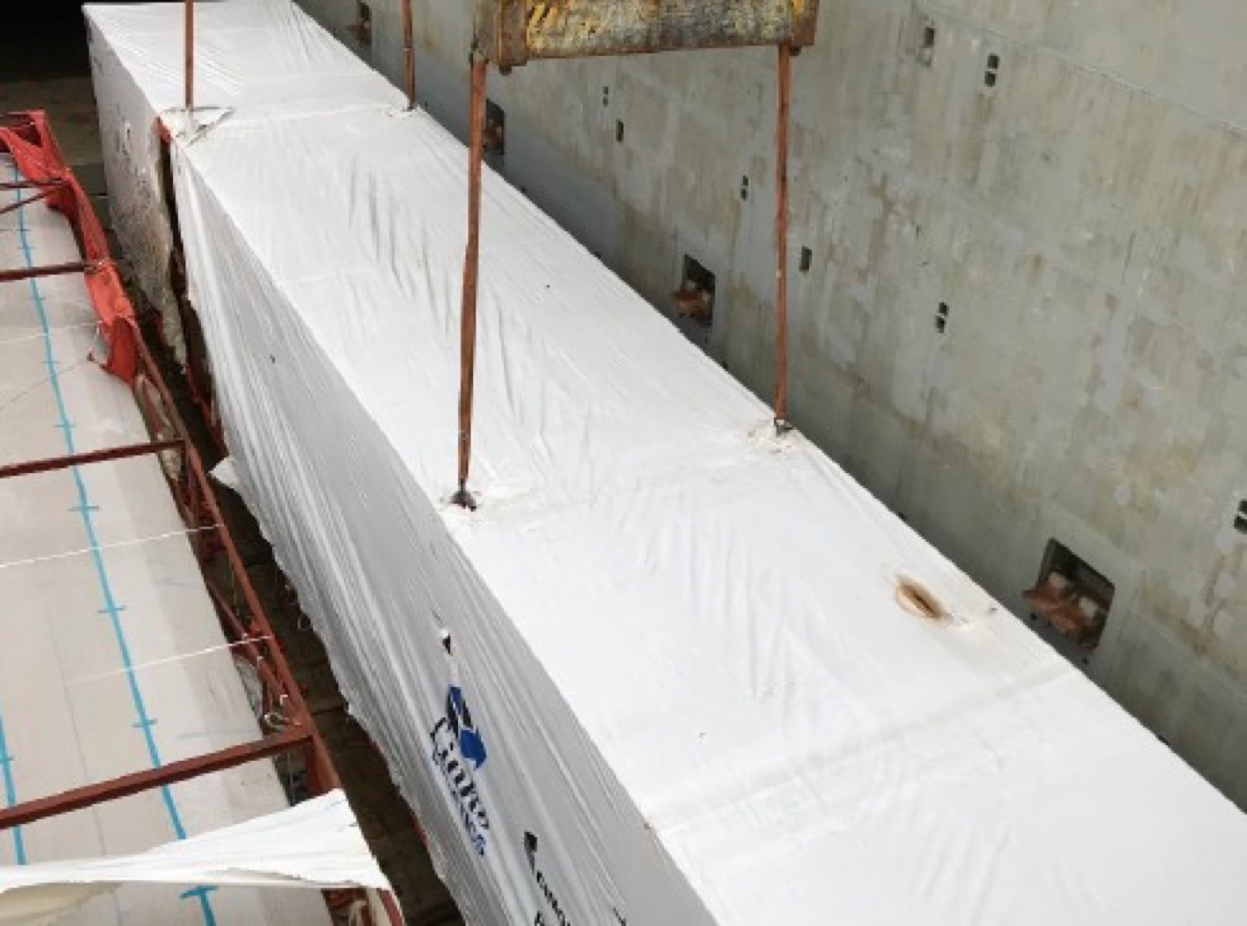Packaged roof panels positioned inside the vessel hold