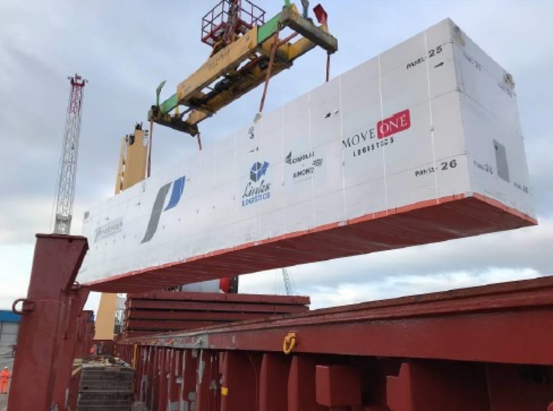 Packaged carbon-fibre roof panels lifted aboard a breakbulk vessel